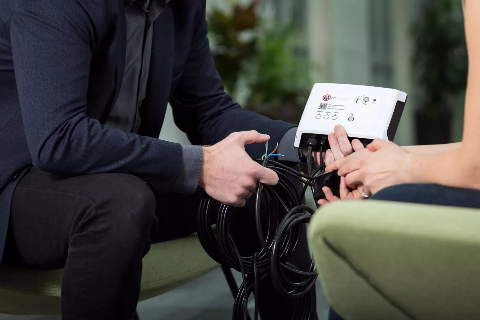 EpiSensor engineers discussing a connected device