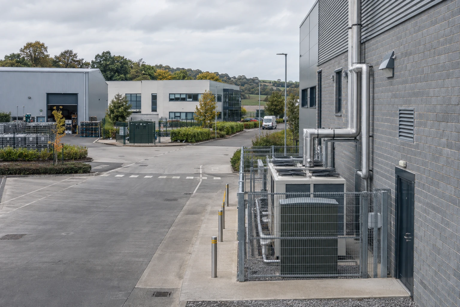 Commercial buildings and outdoor utility plant across an industrial estate.