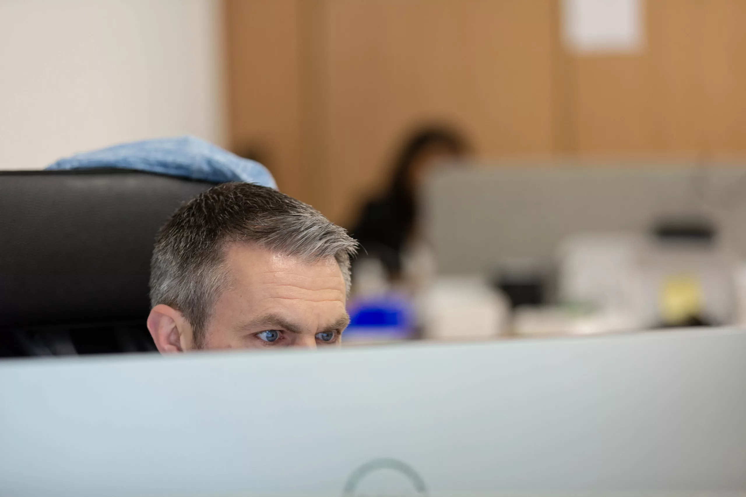 Support engineer working at a desk in the Limerick office