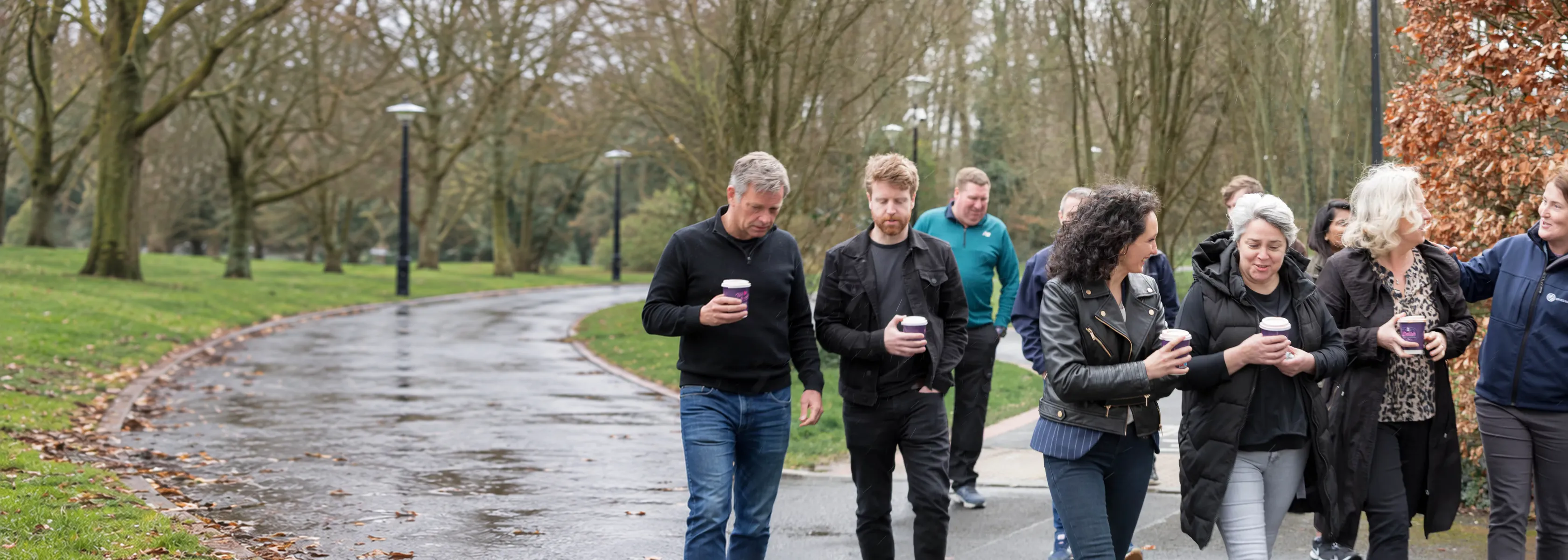 Members of the EpiSensor team walking together along a park path in Limerick, Ireland. The path on the left is a digital extension of the photograph.