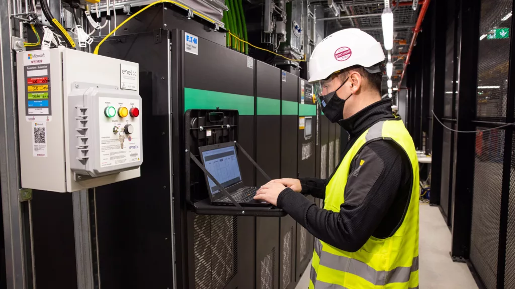 John Byrne, head of operations for Enel X UK & Ireland, performs a system test on the grid-interactive UPS inside a Microsoft datacenter in Dublin, Ireland. Photo by Naoise Culhane.